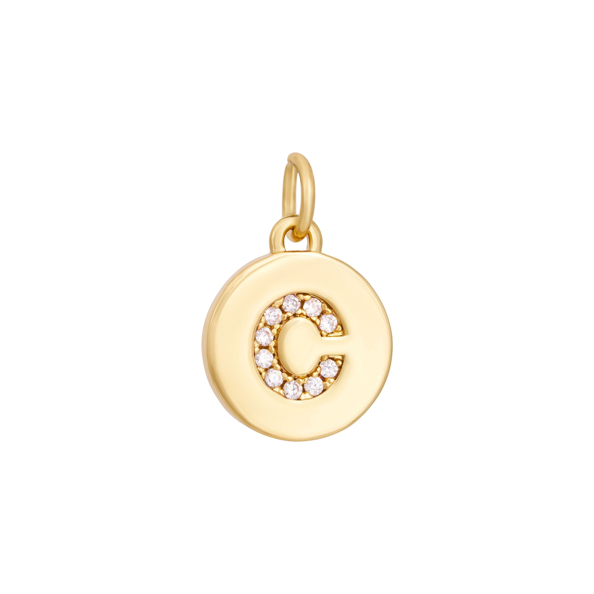 A polished gold "A" coin charm from The Ends' Zircon Letter Coin Charms A-Z collection, showcasing small sparkling diamonds arranged in the shape of the letter. The medallion-style pendant features a slightly rounded edge and is suspended from a loop.
