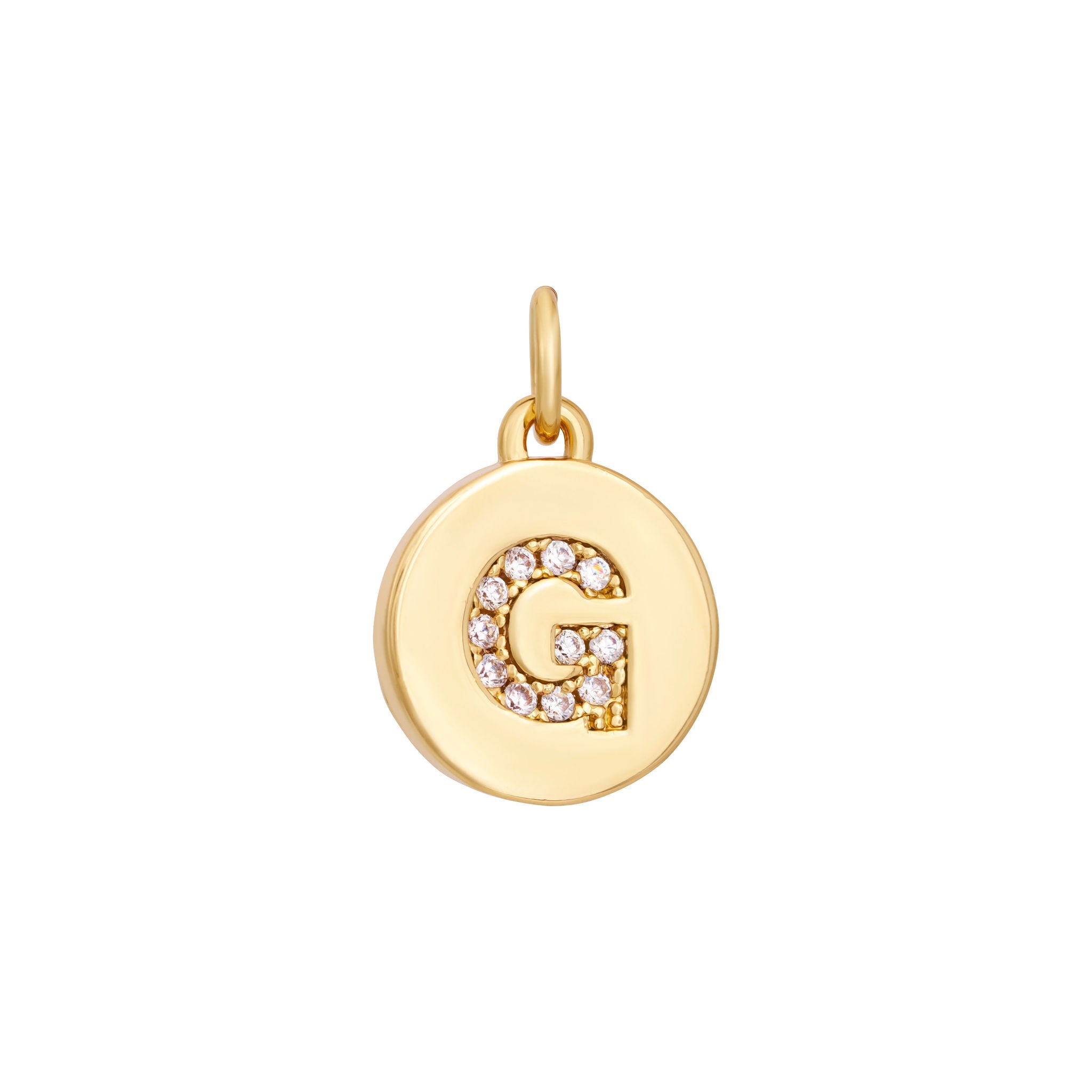 A polished gold "A" coin charm from The Ends' Zircon Letter Coin Charms A-Z collection, showcasing small sparkling diamonds arranged in the shape of the letter. The medallion-style pendant features a slightly rounded edge and is suspended from a loop.