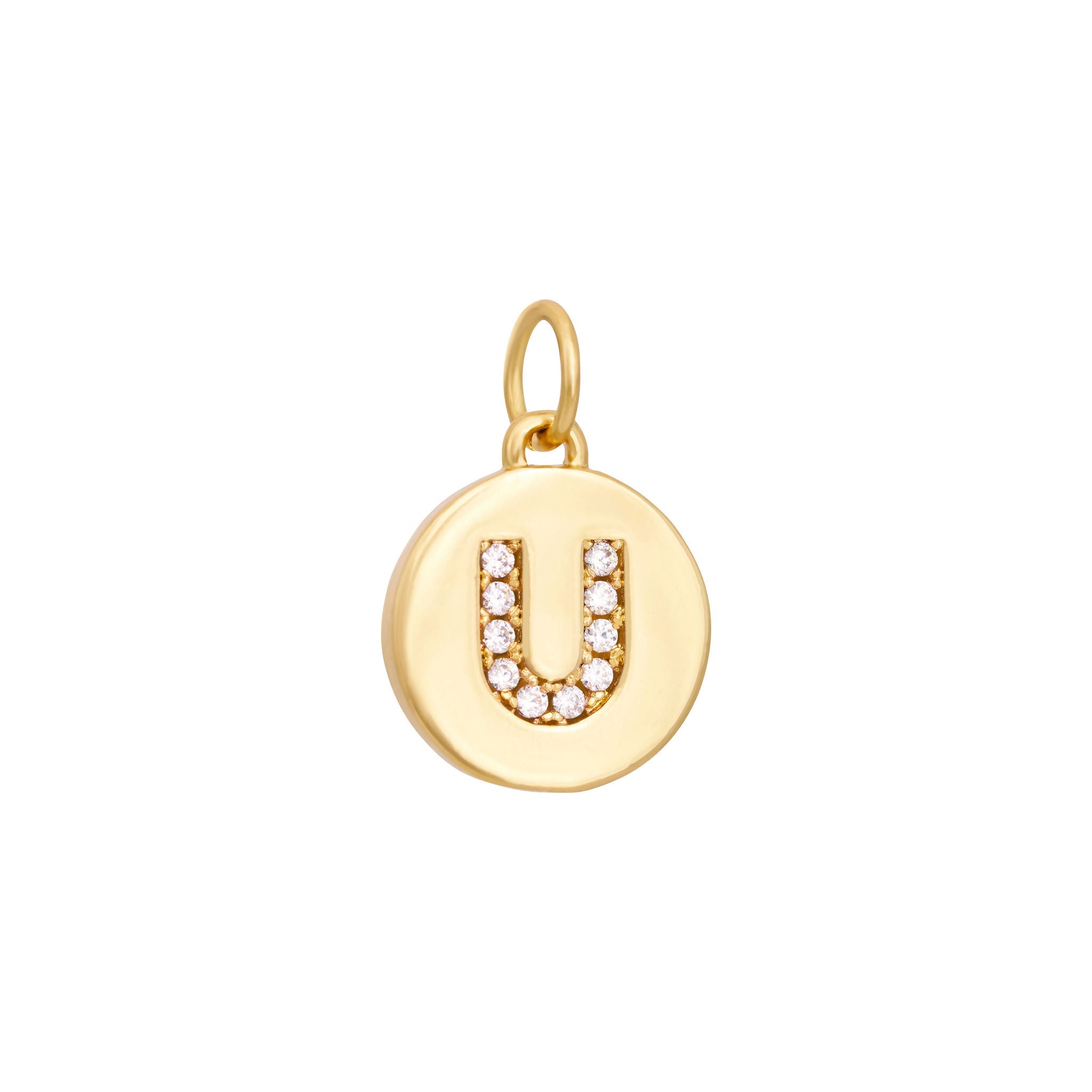 A polished gold "A" coin charm from The Ends' Zircon Letter Coin Charms A-Z collection, showcasing small sparkling diamonds arranged in the shape of the letter. The medallion-style pendant features a slightly rounded edge and is suspended from a loop.