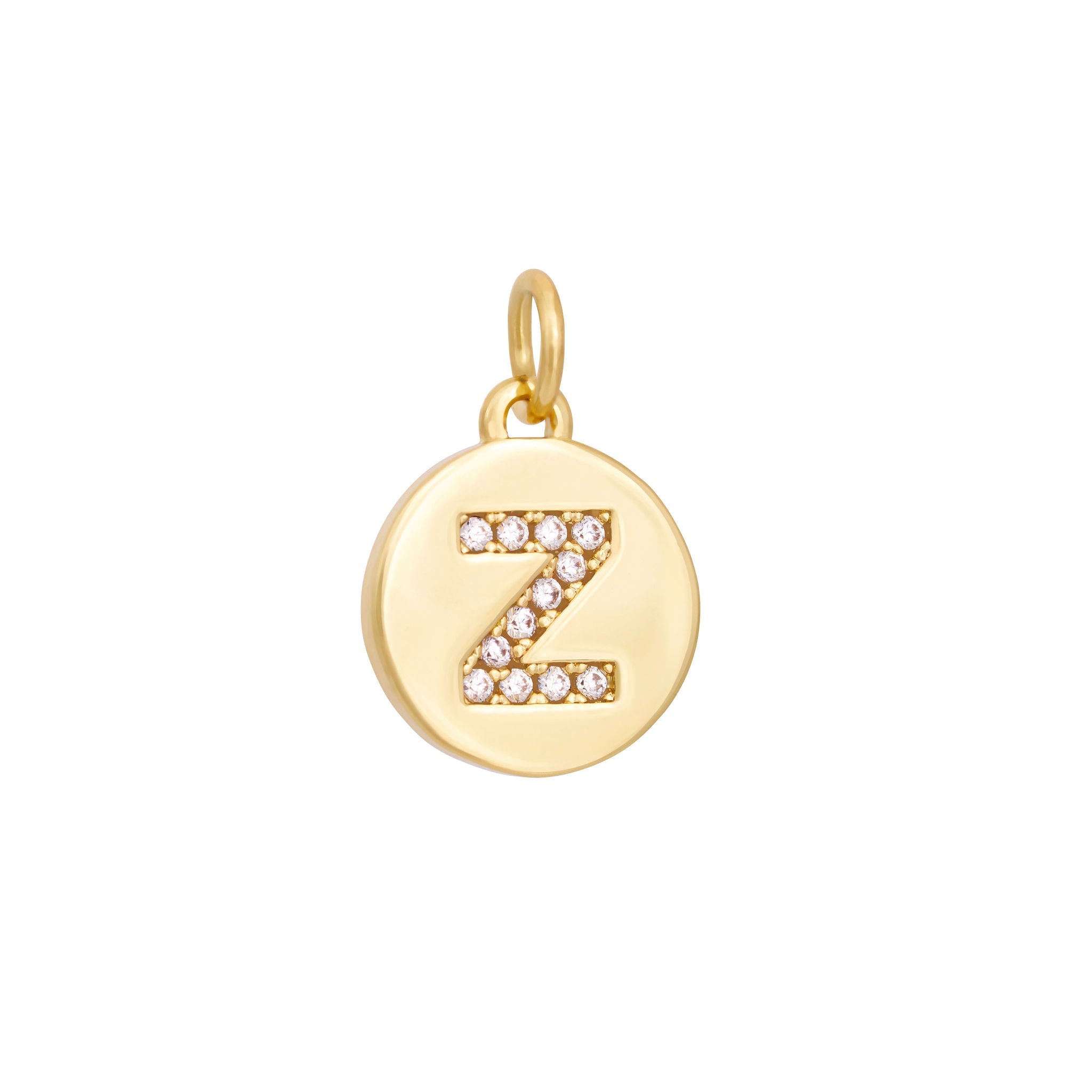 A polished gold "A" coin charm from The Ends' Zircon Letter Coin Charms A-Z collection, showcasing small sparkling diamonds arranged in the shape of the letter. The medallion-style pendant features a slightly rounded edge and is suspended from a loop.